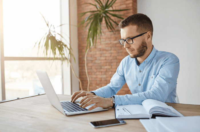 Focused businessman working at his computer